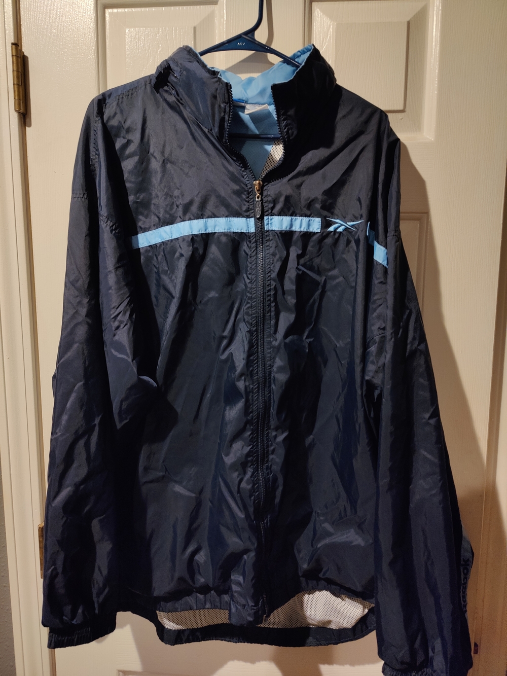 Vintage 90's Reebok Men's Navy Windbreaker with Light Blue Trim